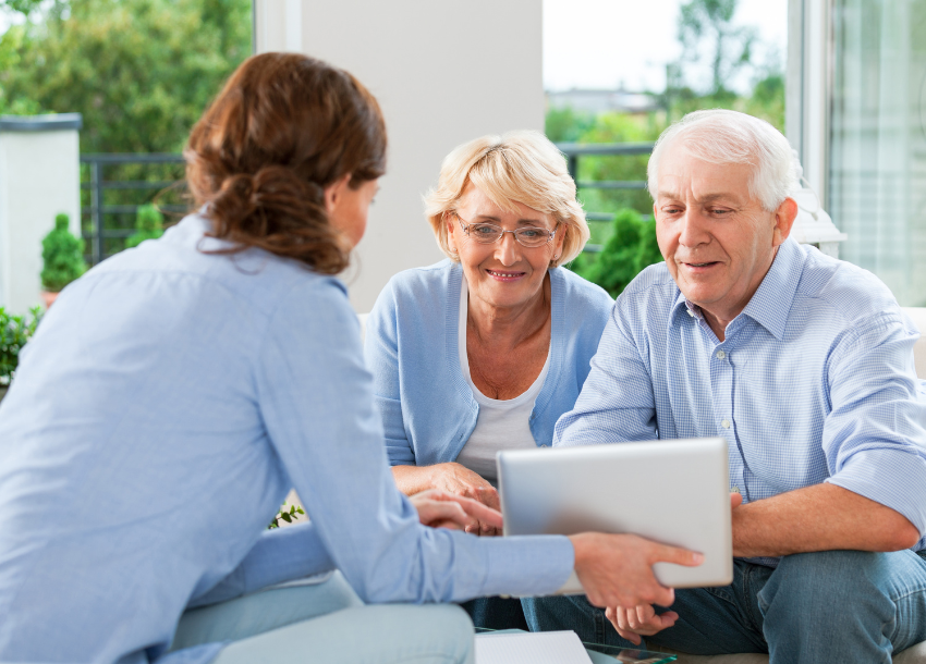 A small business owner talking with members of their team